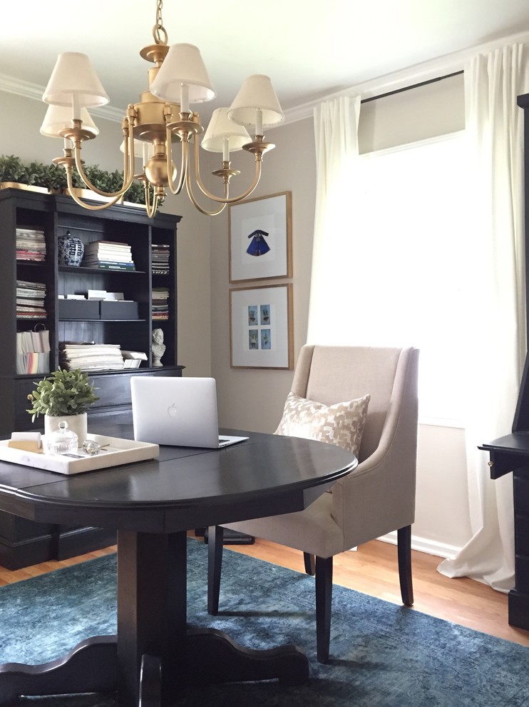 Example of a small transitional freestanding desk light wood floor home office design in Denver with gray walls and no fireplace