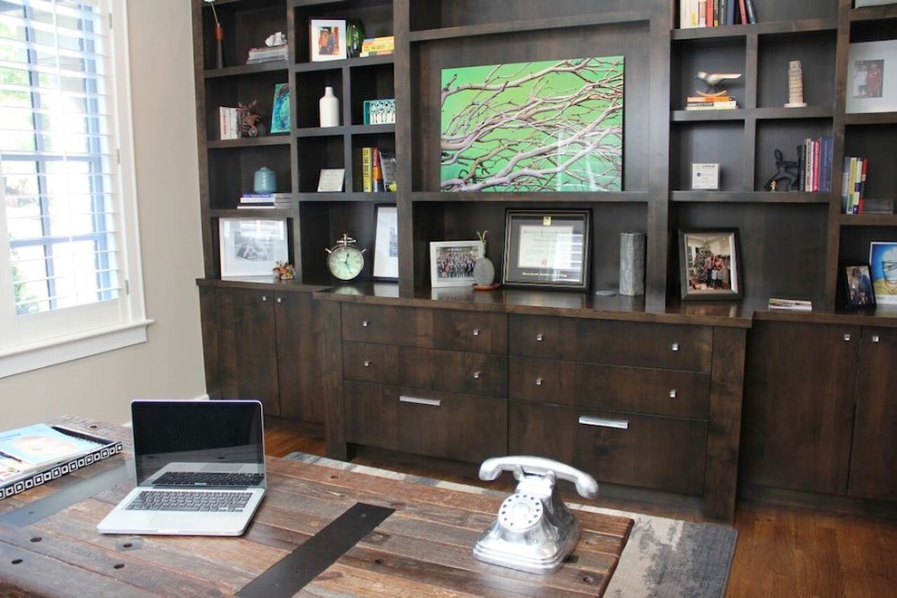 Large urban freestanding desk medium tone wood floor and brown floor study room photo in Denver with gray walls and no fireplace