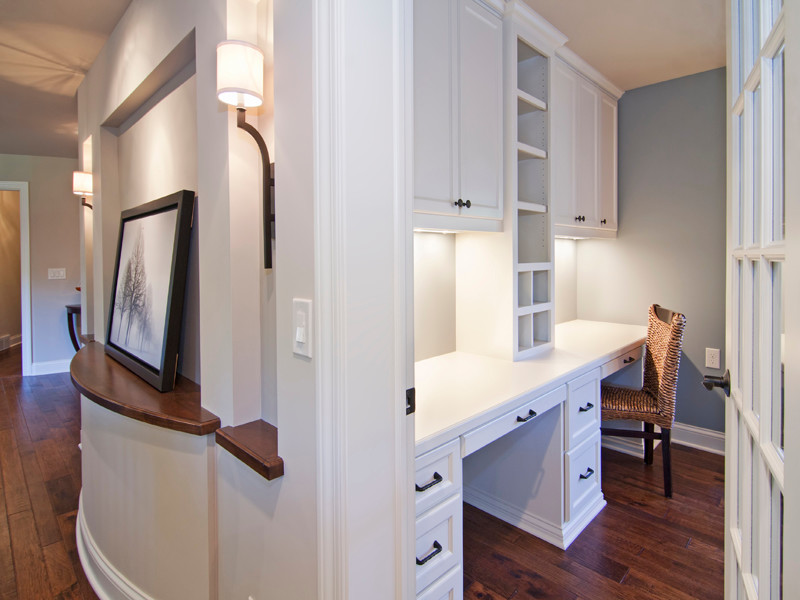 Photo of a small traditional study in Minneapolis with blue walls, medium hardwood flooring and a built-in desk.