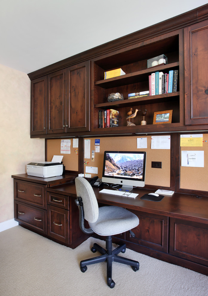 Study room - large traditional built-in desk carpeted study room idea in Chicago with beige walls
