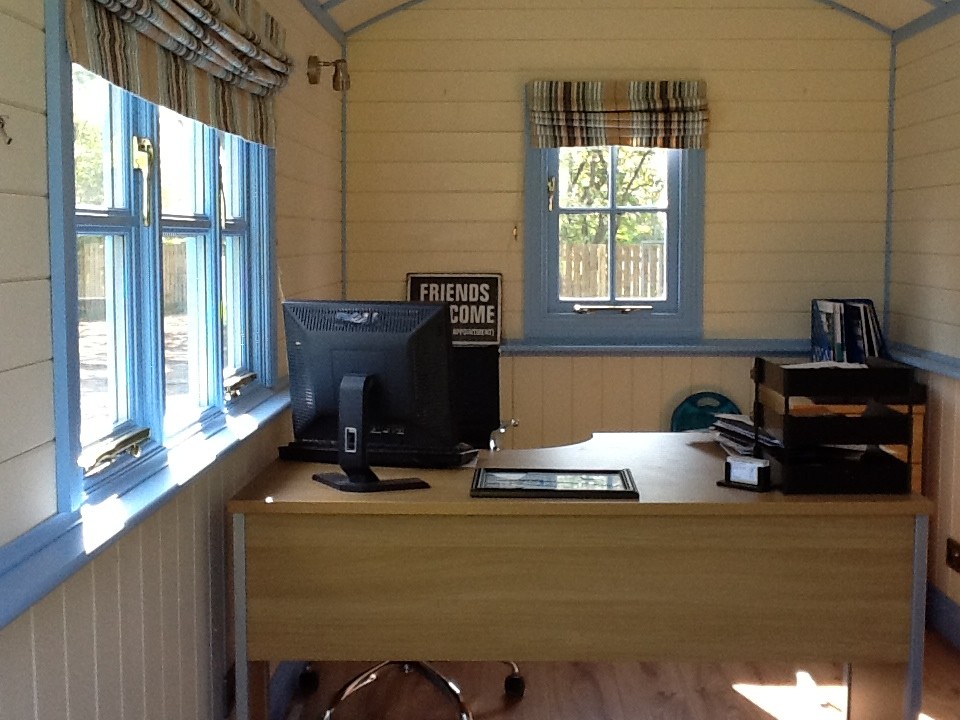 This is an example of a medium sized urban home office in Other.