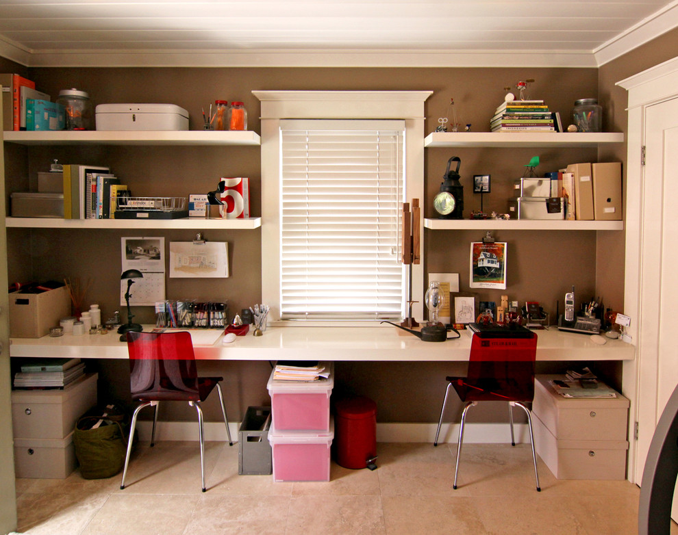 Example of a transitional home office design in Orange County