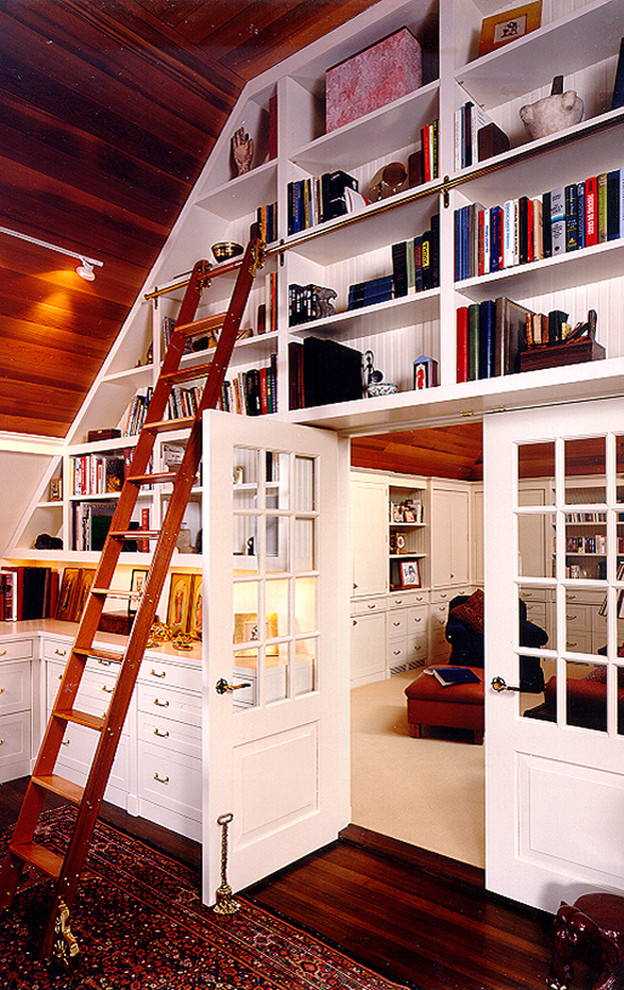Example of a classic dark wood floor home office design in Boston