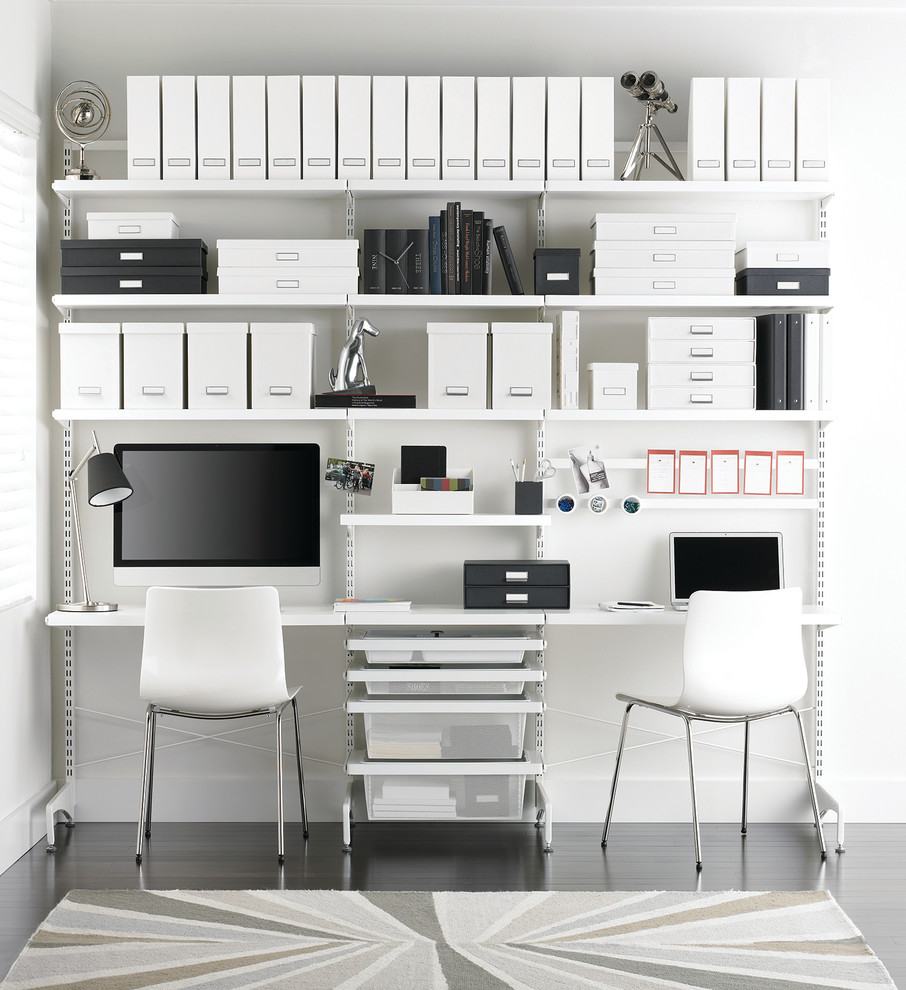 Mid-sized minimalist light wood floor study room photo in Other with white walls