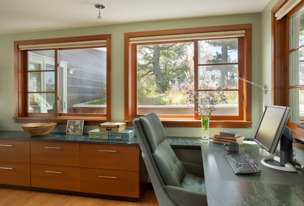 Photo of a contemporary study in Boston with a built-in desk.