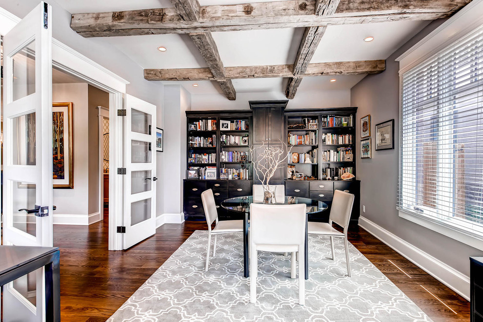 This is an example of a traditional study in Denver with grey walls, dark hardwood flooring, no fireplace and a freestanding desk.