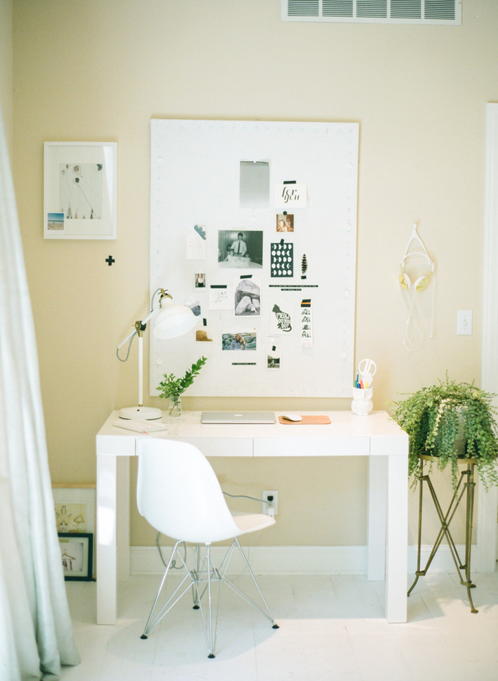 Inspiration for a medium sized eclectic home studio in Other with beige walls, light hardwood flooring and a freestanding desk.