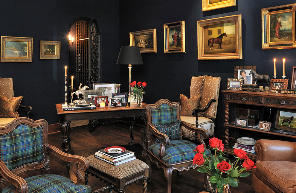 Mid-sized elegant freestanding desk medium tone wood floor home office photo in Houston with black walls