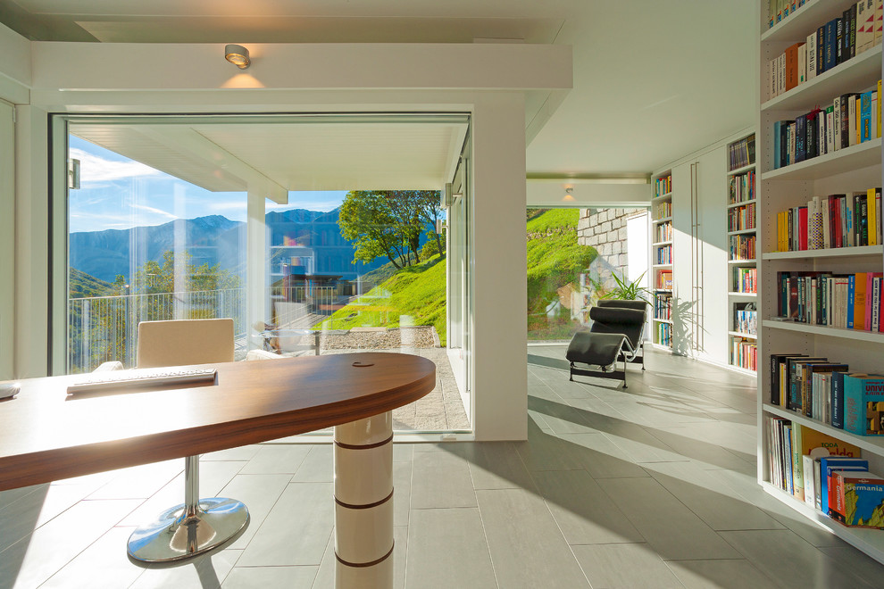 Home studio - contemporary freestanding desk ceramic tile home studio idea in Other with white walls