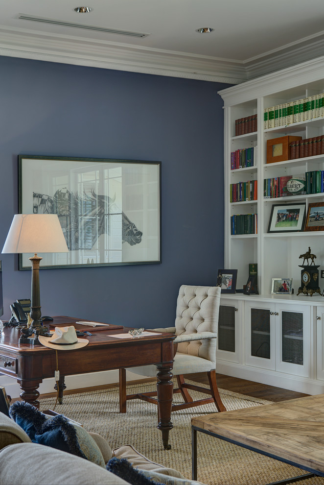 Example of a large transitional freestanding desk medium tone wood floor study room design in Newcastle - Maitland with blue walls