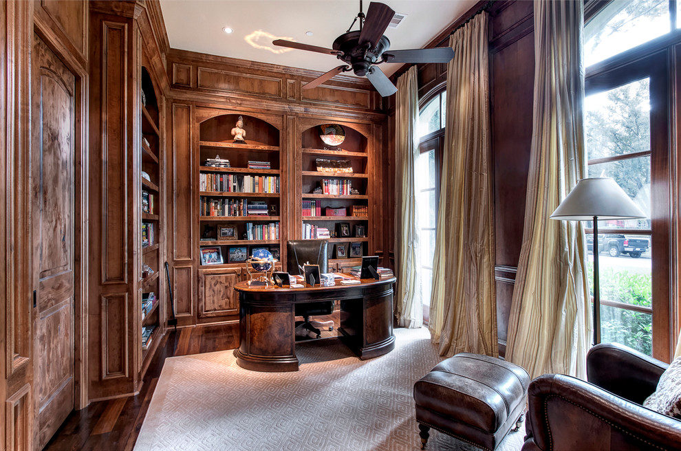 Photo of a medium sized classic study in Houston with brown walls, medium hardwood flooring and a freestanding desk.