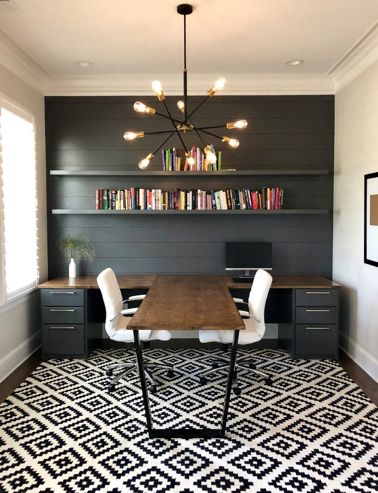 This is an example of a medium sized contemporary home office in Charlotte.