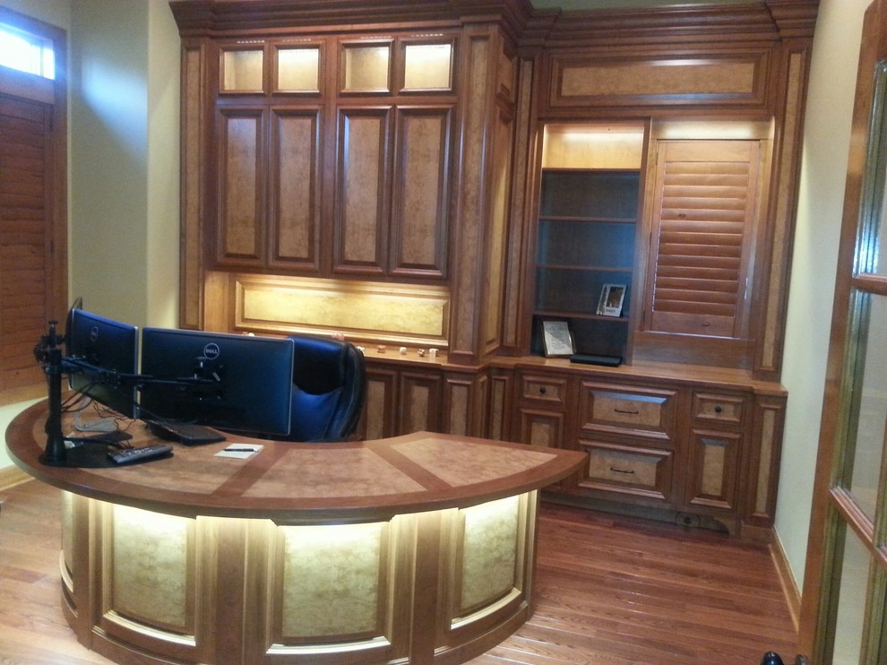 Inspiration for a medium sized classic home office in Other with light hardwood flooring and a built-in desk.