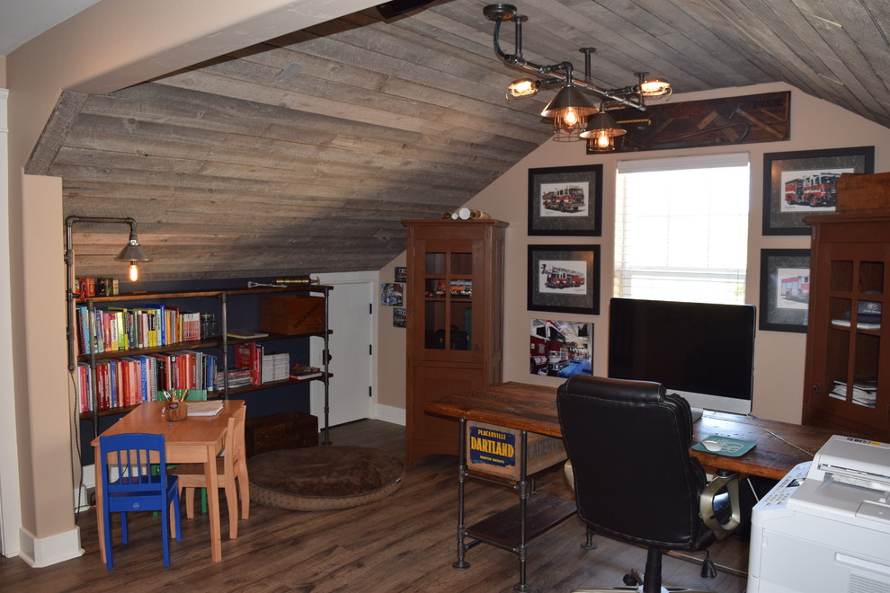 Small industrial study in Denver with blue walls, dark hardwood flooring and a freestanding desk.