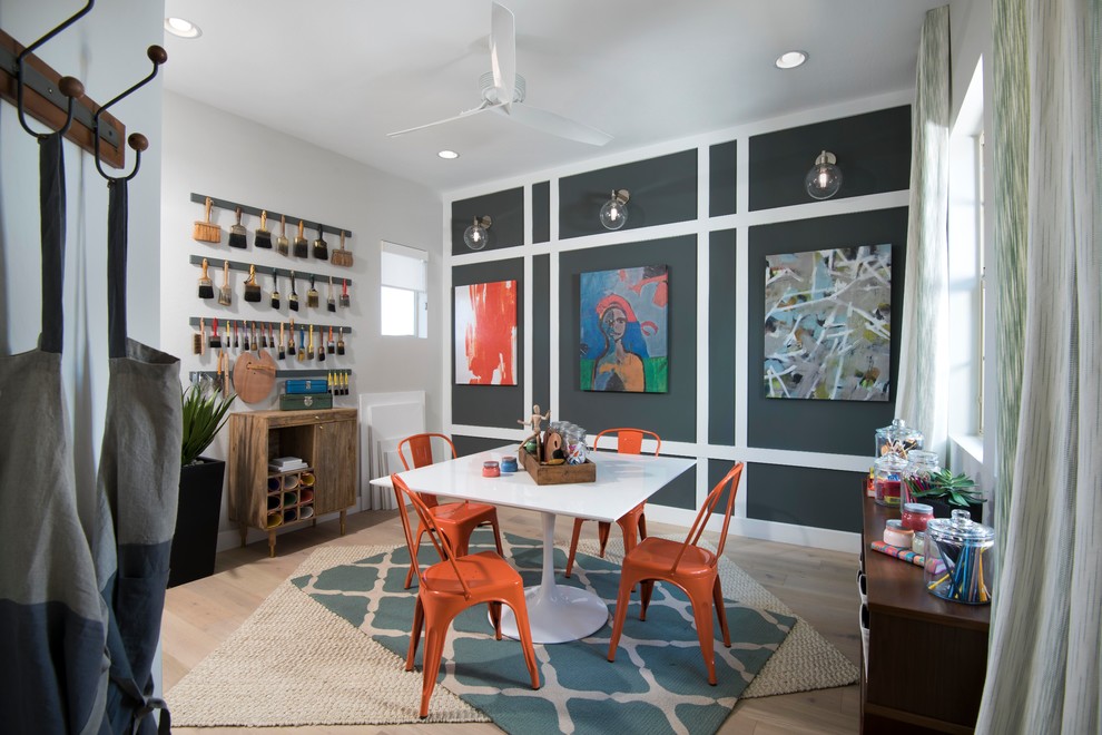 Photo of a contemporary craft room in Phoenix with grey walls, light hardwood flooring and beige floors.