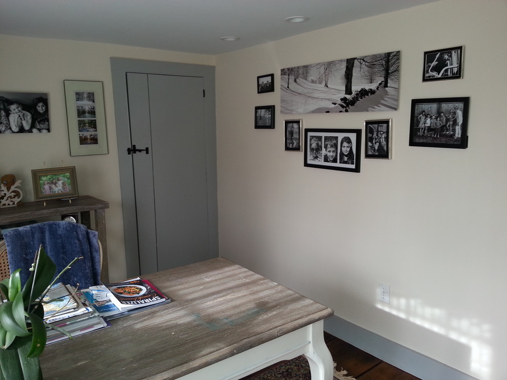 Photo of a beach style home office in New York with beige walls, medium hardwood flooring and a freestanding desk.