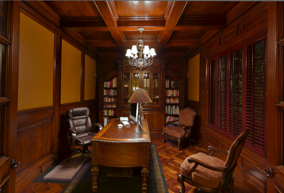 Study room - mid-sized traditional freestanding desk medium tone wood floor study room idea in Chicago with brown walls and no fireplace