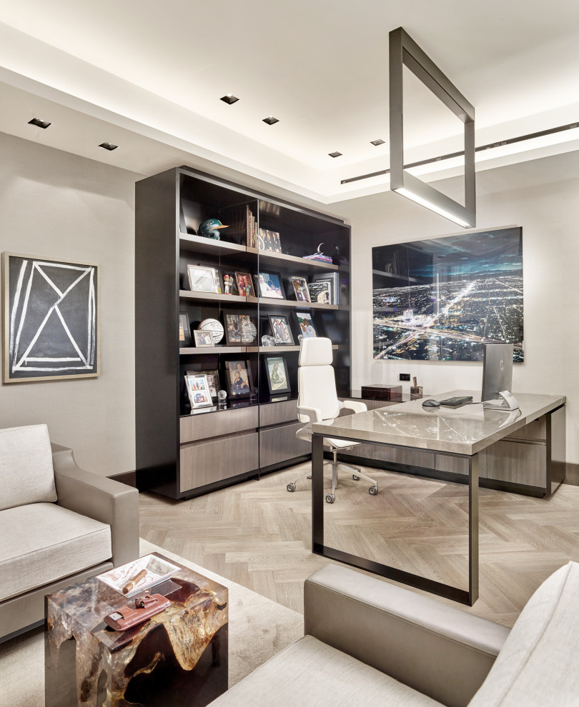Example of a trendy freestanding desk gray floor home office design in Miami with gray walls
