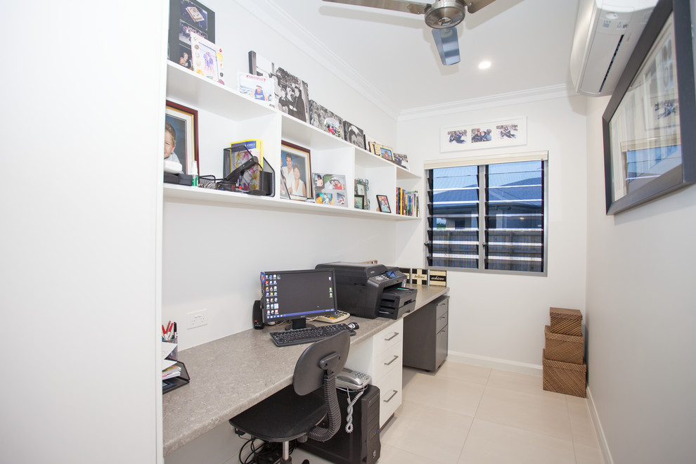 Photo of a medium sized contemporary home studio in Other with white walls, a built-in desk, ceramic flooring and white floors.