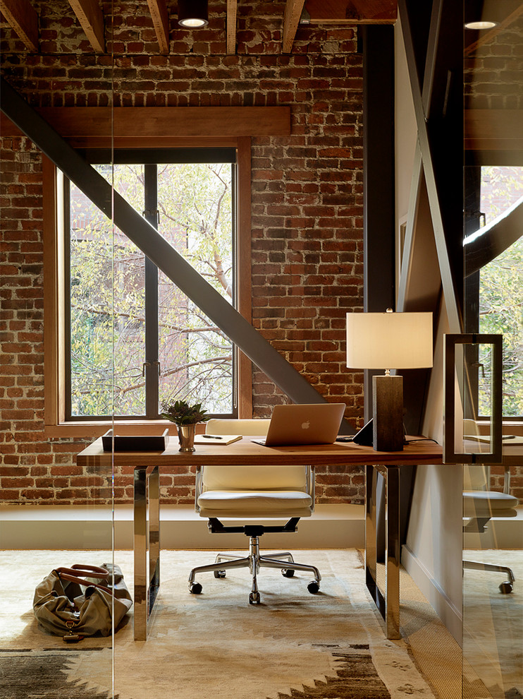 Inspiration for an industrial home office in San Francisco with carpet and a freestanding desk.