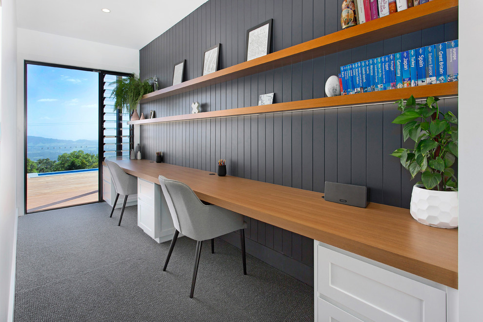 Trendy built-in desk carpeted and gray floor study room photo in Wollongong with gray walls