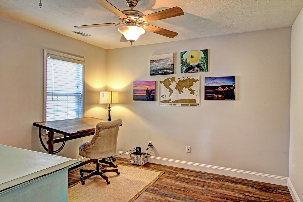 Small beach style freestanding desk vinyl floor study room photo in Other with gray walls and no fireplace