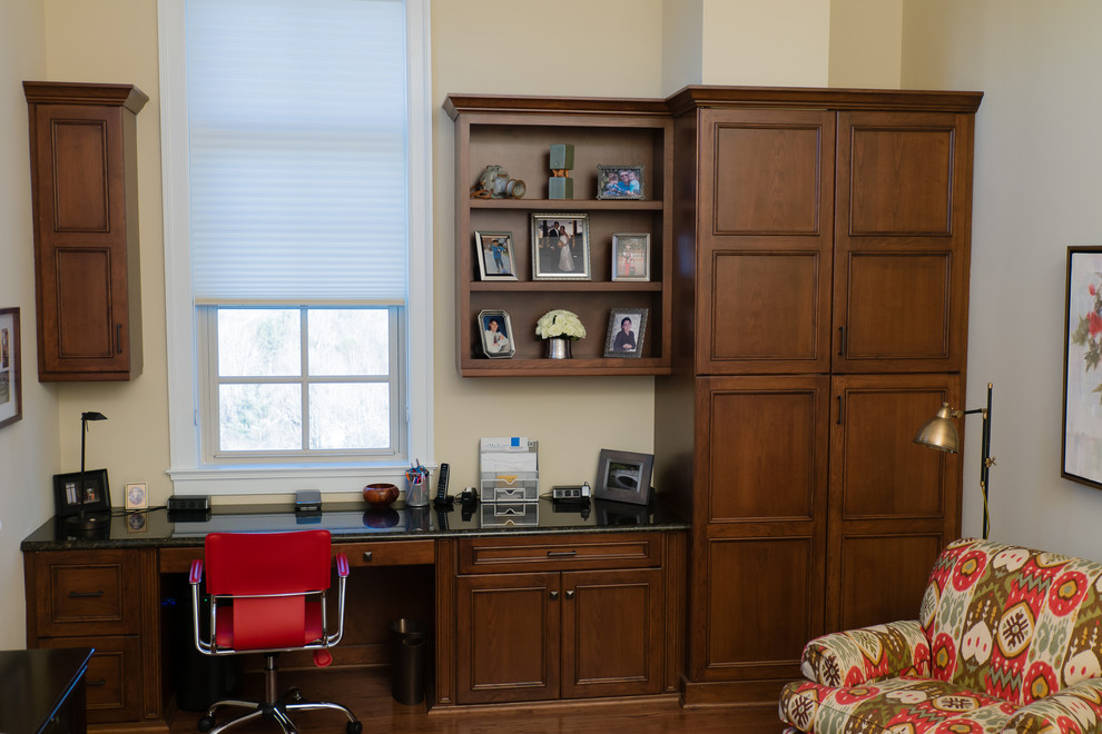 Photo of a medium sized traditional home office in Charlotte with medium hardwood flooring and a built-in desk.