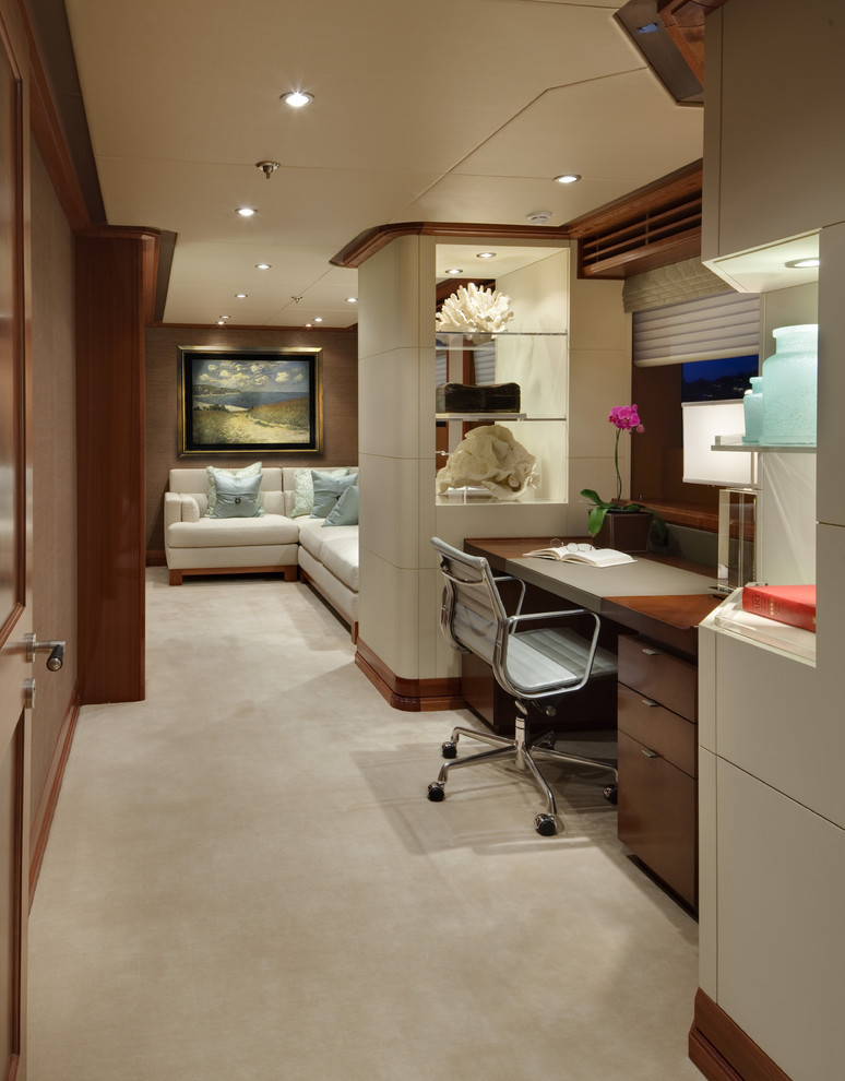Example of a trendy built-in desk carpeted home office design in Seattle