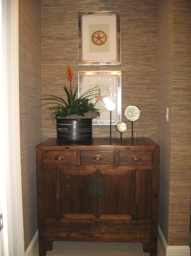 Inspiration for a mid-sized coastal home office remodel in Orange County with brown walls