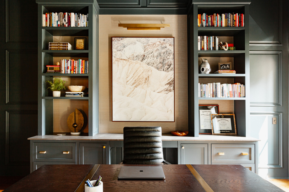 Mid-sized transitional freestanding desk medium tone wood floor, brown floor, vaulted ceiling and wall paneling study room photo in Dallas with green walls, a standard fireplace and a stone fireplace