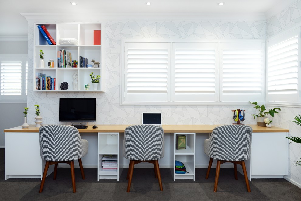 Example of a large trendy built-in desk study room design in Sydney