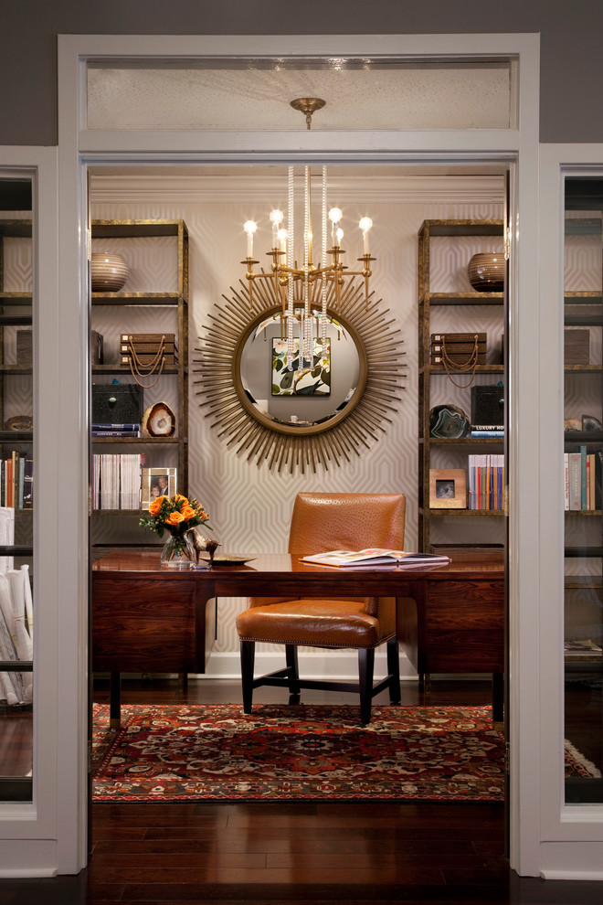 This is an example of an eclectic home office in Atlanta with dark hardwood flooring and a freestanding desk.