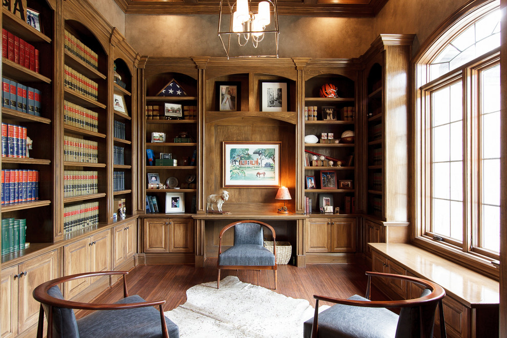 This is an example of a traditional home office in Cincinnati with bamboo flooring.