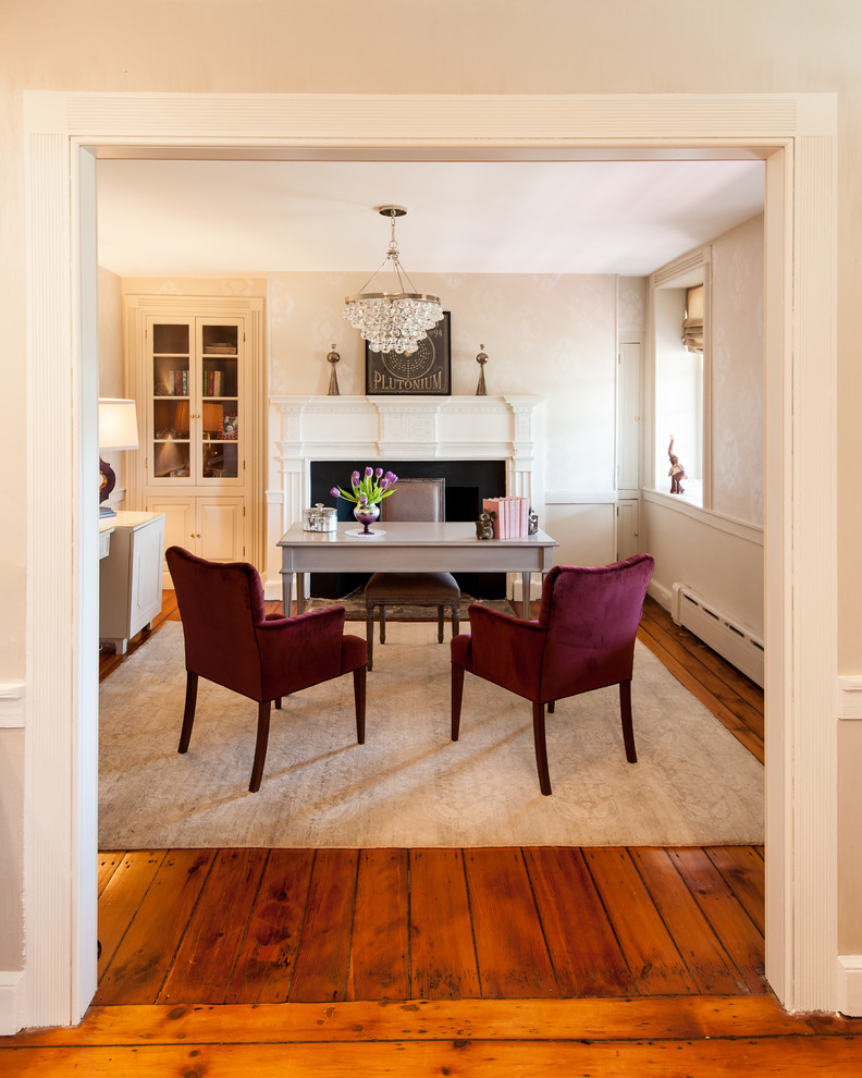 Inspiration for a mid-sized cottage freestanding desk medium tone wood floor and brown floor study room remodel in Philadelphia with beige walls, a standard fireplace and a stone fireplace