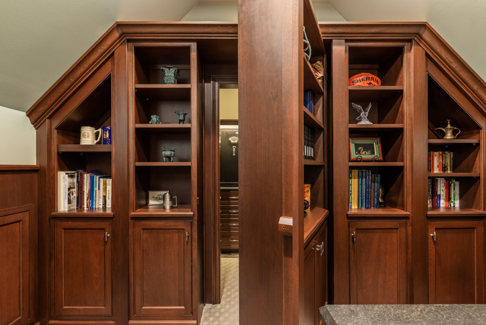 This is an example of a large classic home office in Other with carpet and a built-in desk.