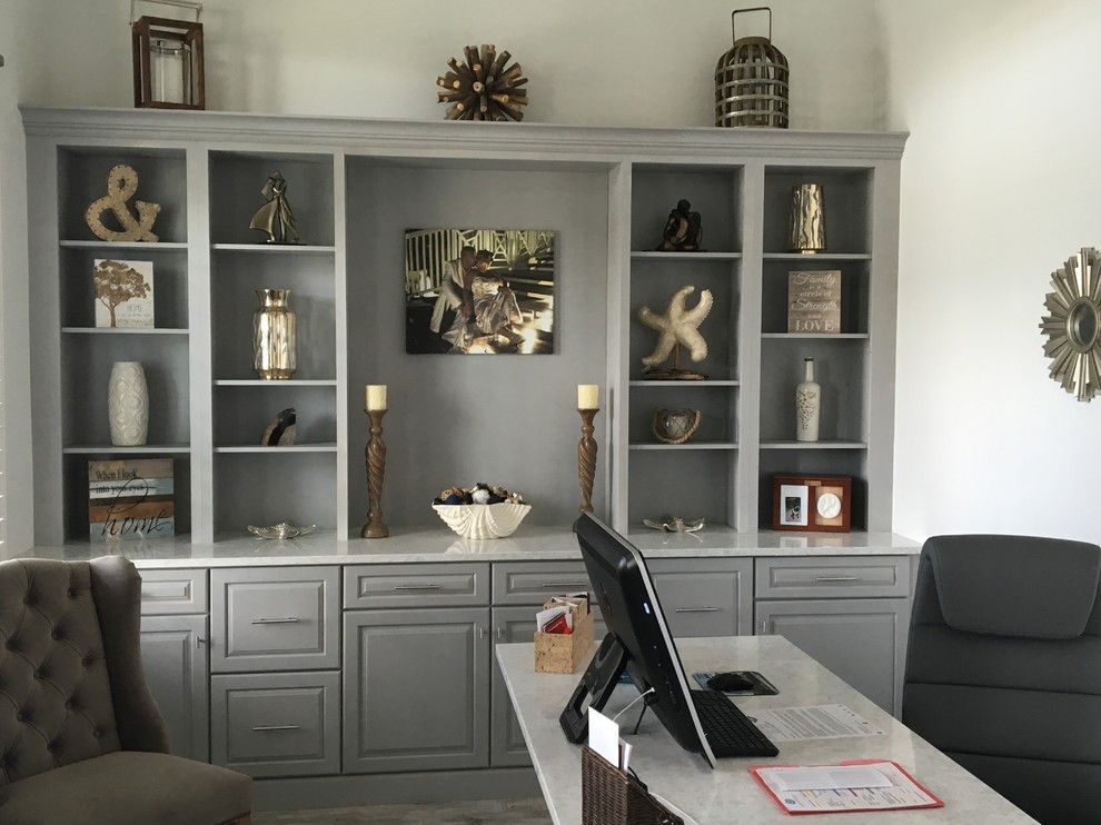 Inspiration for a mid-sized timeless freestanding desk marble floor and gray floor study room remodel in Orlando with white walls