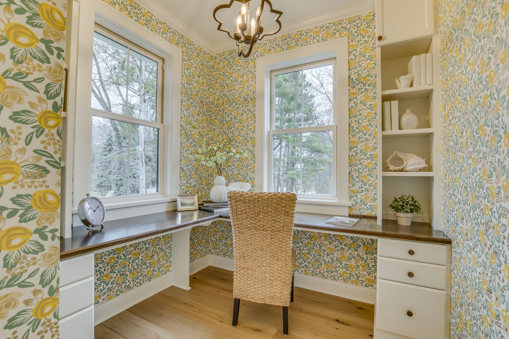 Study room - mid-sized cottage built-in desk light wood floor and beige floor study room idea in Minneapolis with no fireplace and multicolored walls