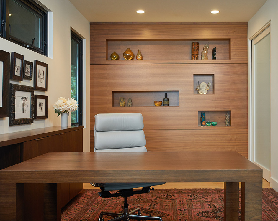 Study room - contemporary freestanding desk light wood floor, brown floor and wood wall study room idea with beige walls