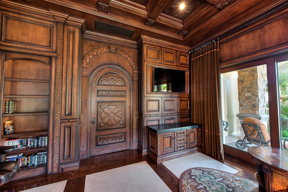 Mid-sized elegant built-in desk marble floor study room photo in Phoenix with brown walls