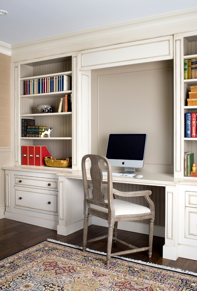Study room - large traditional built-in desk dark wood floor study room idea in Toronto with beige walls and no fireplace