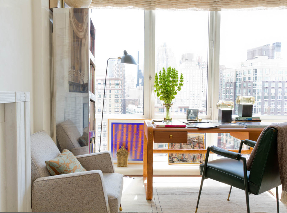 Photo of a contemporary home office in New York with a freestanding desk.