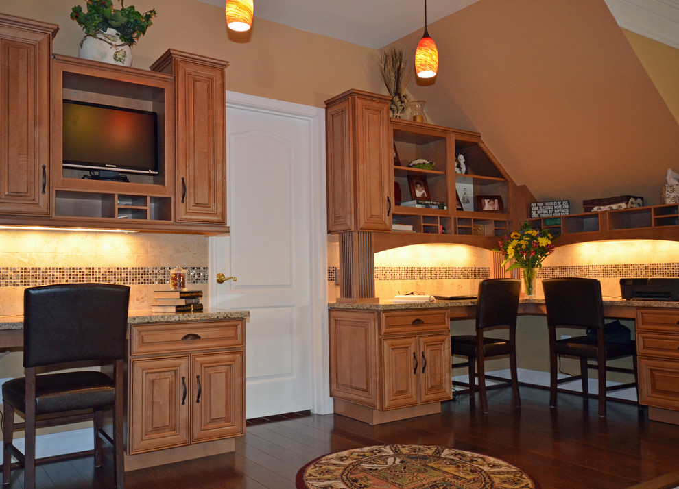 Inspiration for a timeless built-in desk dark wood floor study room remodel in DC Metro