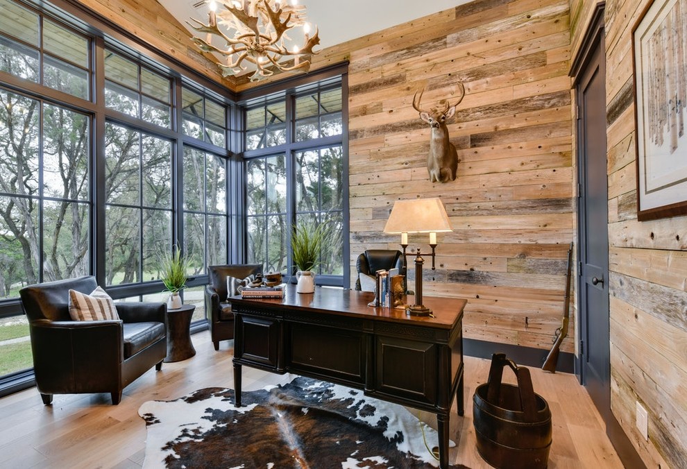 Design ideas for a rustic study in Austin with light hardwood flooring, no fireplace and a freestanding desk.