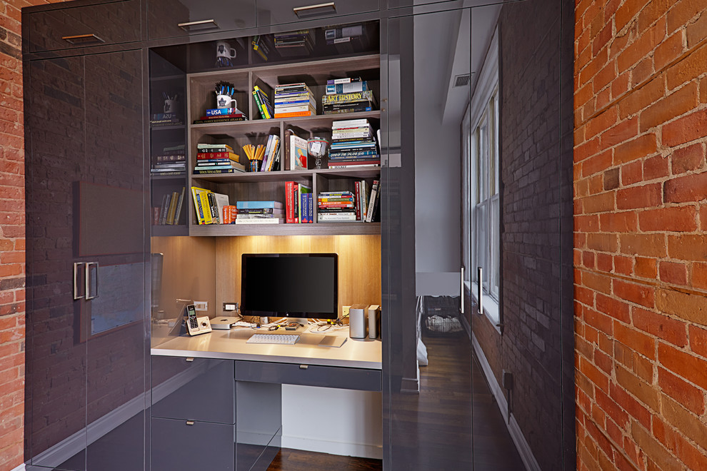 Design ideas for a contemporary home office in Toronto with a built-in desk.