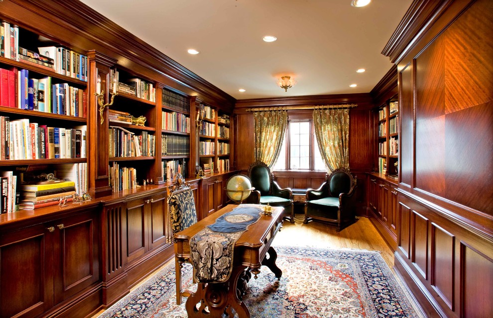 Inspiration for a timeless freestanding desk medium tone wood floor home office remodel in Seattle with no fireplace