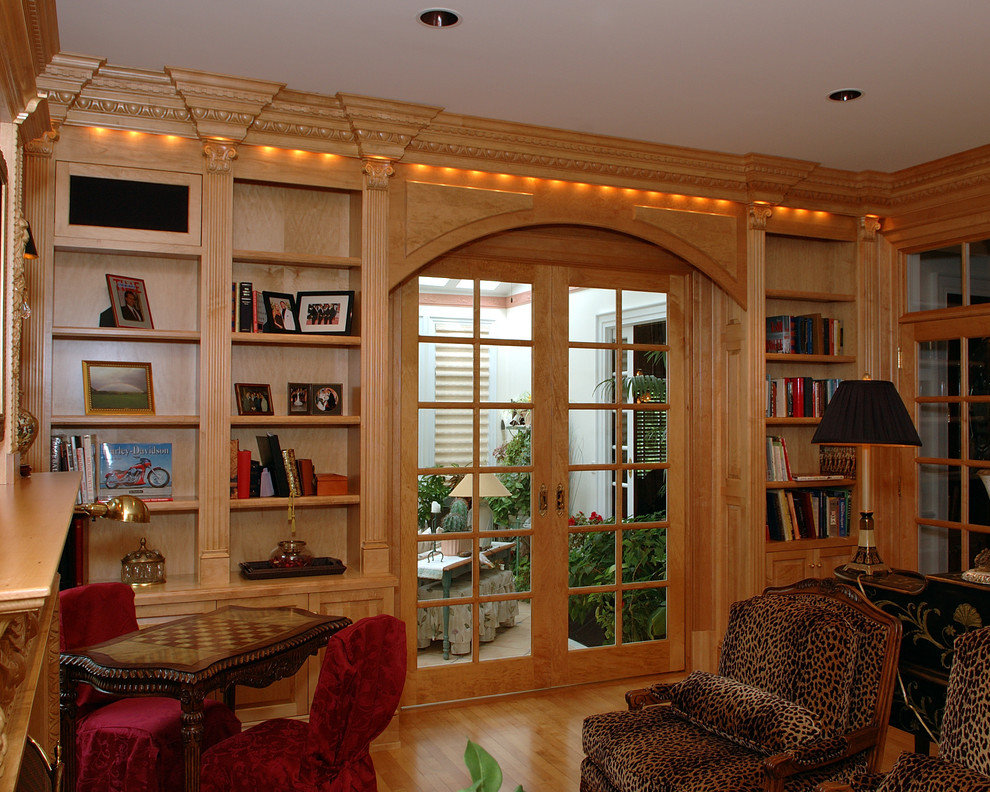 Photo of a large contemporary study in Philadelphia with light hardwood flooring and a freestanding desk.