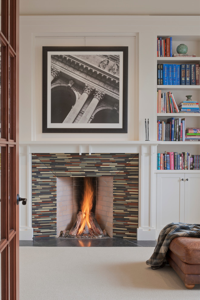 Inspiration for a traditional study in Seattle with white walls, carpet, a standard fireplace and a tiled fireplace surround.