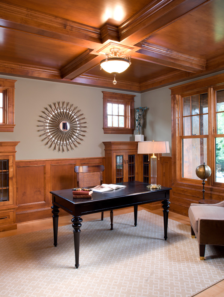 This is an example of a medium sized classic study in Minneapolis with grey walls, medium hardwood flooring, a freestanding desk, beige floors and no fireplace.
