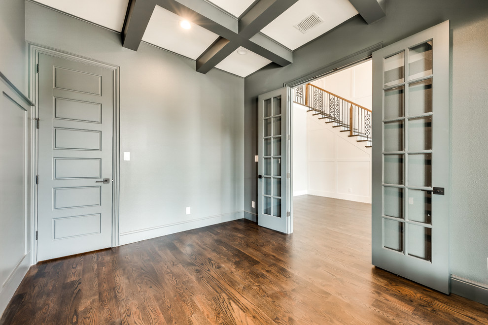 Inspiration for a mid-sized transitional freestanding desk medium tone wood floor and brown floor study room remodel in Dallas with gray walls