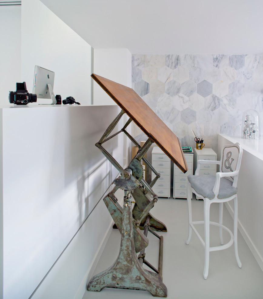 Example of an eclectic home office design in London